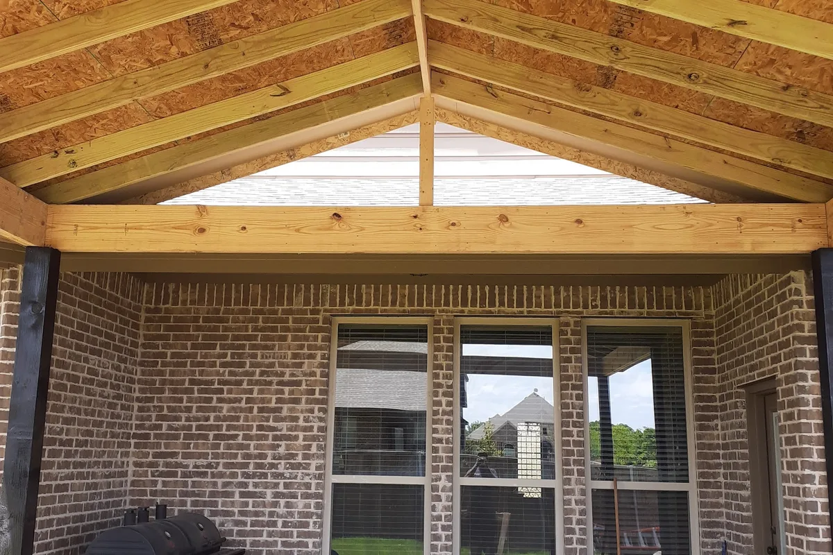 Carpenter measuring and cutting trim
